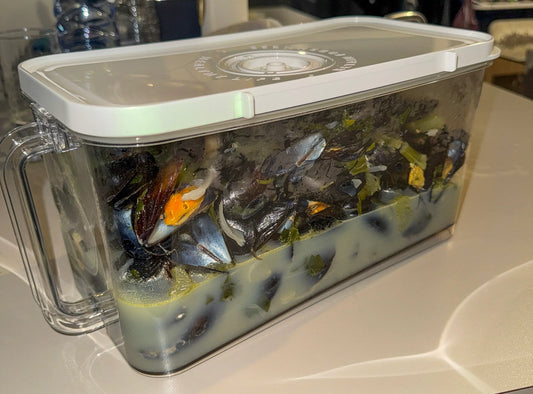 Cooked mussels stored in the VO Food Container on a kitchen counter