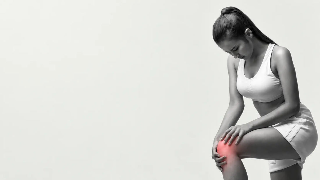 Woman holding her knee after sitting with knee stiffness