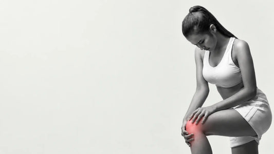 Woman holding her knee after sitting with knee stiffness