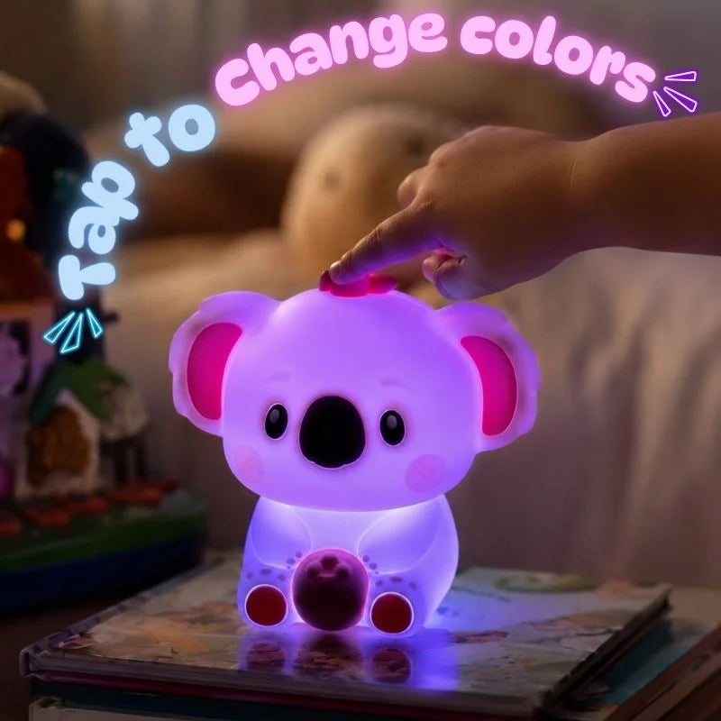Child tapping the Voala Buddy silicone koala night light to change colors at bedtime